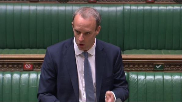 A man wearing a suit in mid-speech. | Al Jazeera July 6, 2020