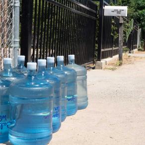 Bottled water is routinely delivered to residents of Tombstone Territory, a cluster of homes in central Fresno County reliant on increasingly scarece groundwater. | Courtesy of the Leadership Counsel for Justice and Accountability